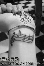 Bellissimo e popolare modello di tatuaggio nota braccio
