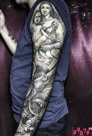 Tatuaggio braccio bianco e nero fiore angelo vergine
