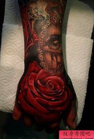 a red rose tattoo pattern on the back of a hand 88733-a black arm tattoo with a different personality