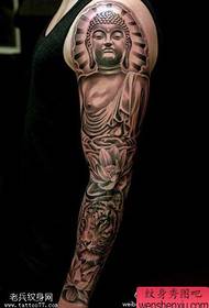 tatuiruotės figūra rekomendavo juodos ir pilkos spalvos tradicinį Budos tatuiruotę
