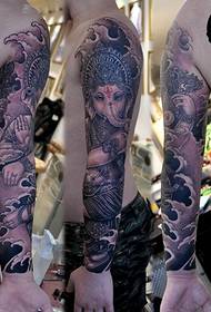 Tatuaggio braccio fiore - dio elefante - tatuaggio arte