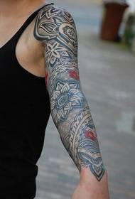 German tattoo artist GERD classic totem flower arm tattoo