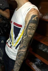 Blummenarm Tattoo Bild vum Lotus a Buddha