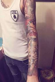 Flower arm tattoo pattern with flower and prajna