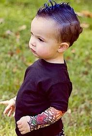 Stylish cute kid's spider web flower arm tattoo