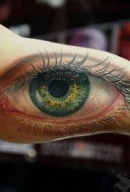 žalios akies tatuiruotės raštas didžiosios rankos vidinėje pusėje