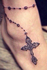 tatuaggio cavigliera croce femmina 90084 - simpatico tatuaggio bambina dagli occhi grandi