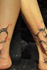 Totem tattoo of a couple's ankle personality