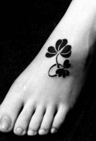 girls feet four-leaf clover beautiful tattoo