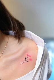 clear white clavicle with small flower tattoo pattern