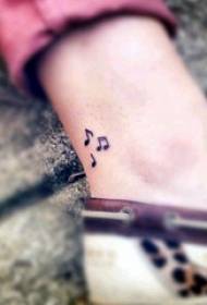 foot tibia tattoo girl ankle on black note ຮູບພາບ tattoo