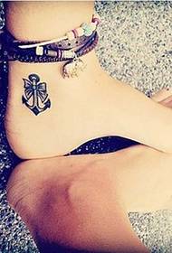 simple totem tattoo on the ankle