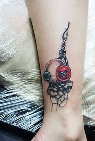 creative button pendant ankle tattoo