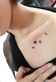 small fresh bird tattoo pattern under the collarbone