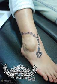 Beautiful small fresh anklet tattoo on the foot