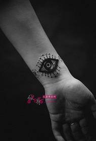 creative black and white eye world wrist tattoo