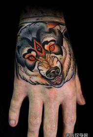 a European and American wolf head tattoo on the back of the hand