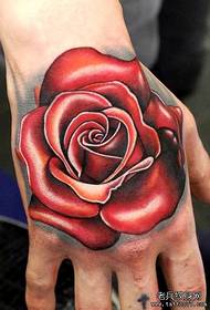 a super-stereo rose tattoo on the back of the hand