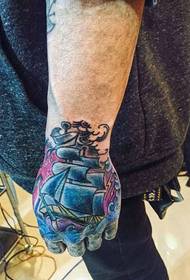 hand color sailboat tattoo picture is very eye-catching