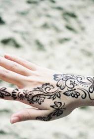 female hand back flower totem fashion tattoo