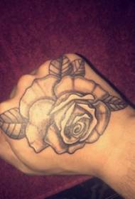Tattoo Roses boys on the back of the black-and-grey rose tattoo picture