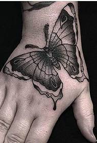 foto de tatuaxe de mariposa negra de volta
