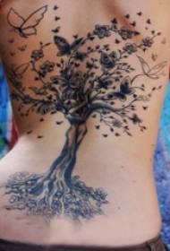 tetoválás ágak a lány hátán fekete-szürke fa tetoválás kép