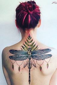 Straight and geometric tattoo on the vertebrae