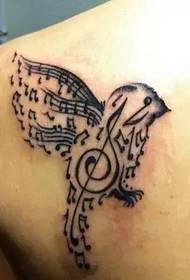 back shoulder bird note tattoo