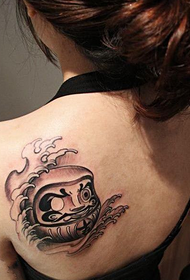 girls shoulder Dharma tumbler tattoo work