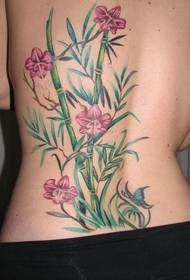 girl back bamboo flower tattoo