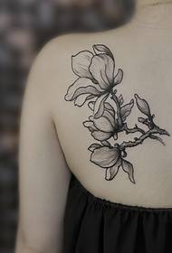 delicate back one magnolia tattoo tattoo