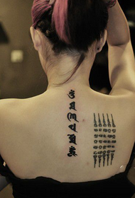 female Sanskrit true back tattoo