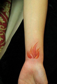 a beautiful flame tattoo picture of a woman's wrist