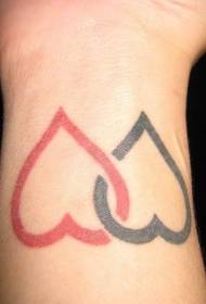 червен и черен модел на татуировка на китката във формата на сърце