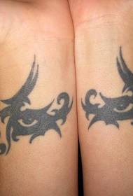 wrist totem tattoo