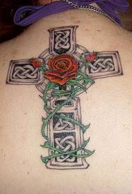 cross and rose tattoo on the back