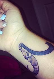 Polso Capricorno con logo tatuaggio