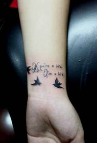 girl's wrist small and beautiful tattoo