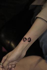 wrist small fresh bow tattoo
