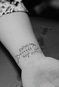 wrist black and white small fish bone tattoo