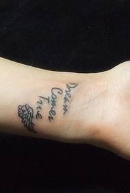 wrist A stylish wing English tattoo