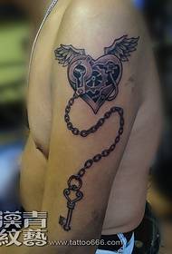mechanical heart tattoo on the arm