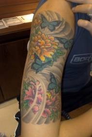 motivo tatuaggio braccio farfalla e peonia