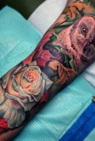 arm gorgeous realistic color owl flower tattoo