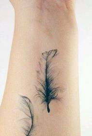 a female wrist feather tattoo pattern