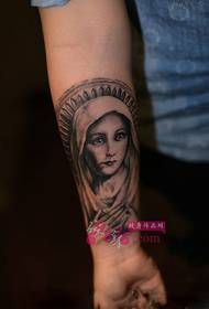 Maagd Maria pols tattoo foto