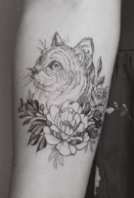 very artistic sense of a group of black and gray small tattoo designs on the arm