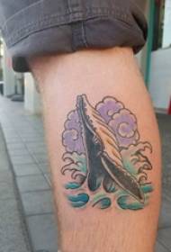 tattoo walfisk jonges keallen op walfisk en spuitje tatoeaazjefoto's