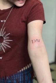 Tattoo symbol girl with simple line tattoo symbol on arm
